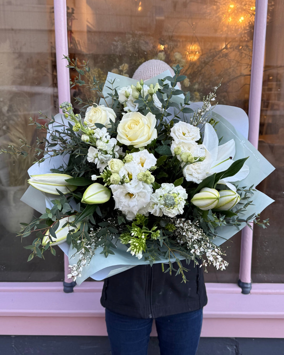 White Bouquet with Roses, Lilys, Lisianthus, Ginista and some mixed foliages.