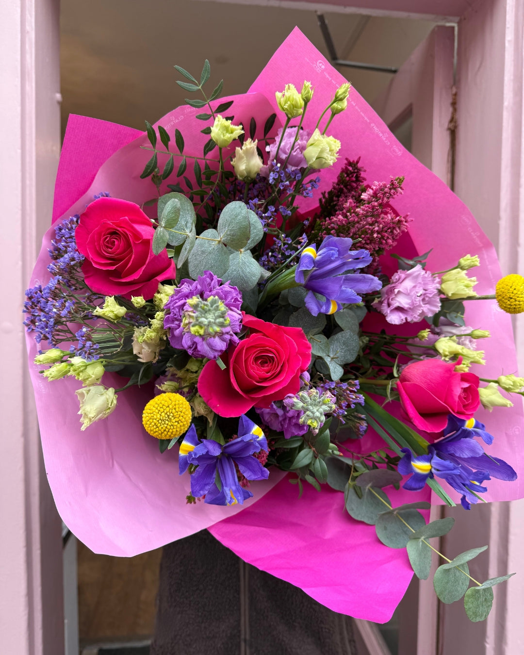 Pink and purple Bouquet with roses, iris, lisianthus, stocks and more